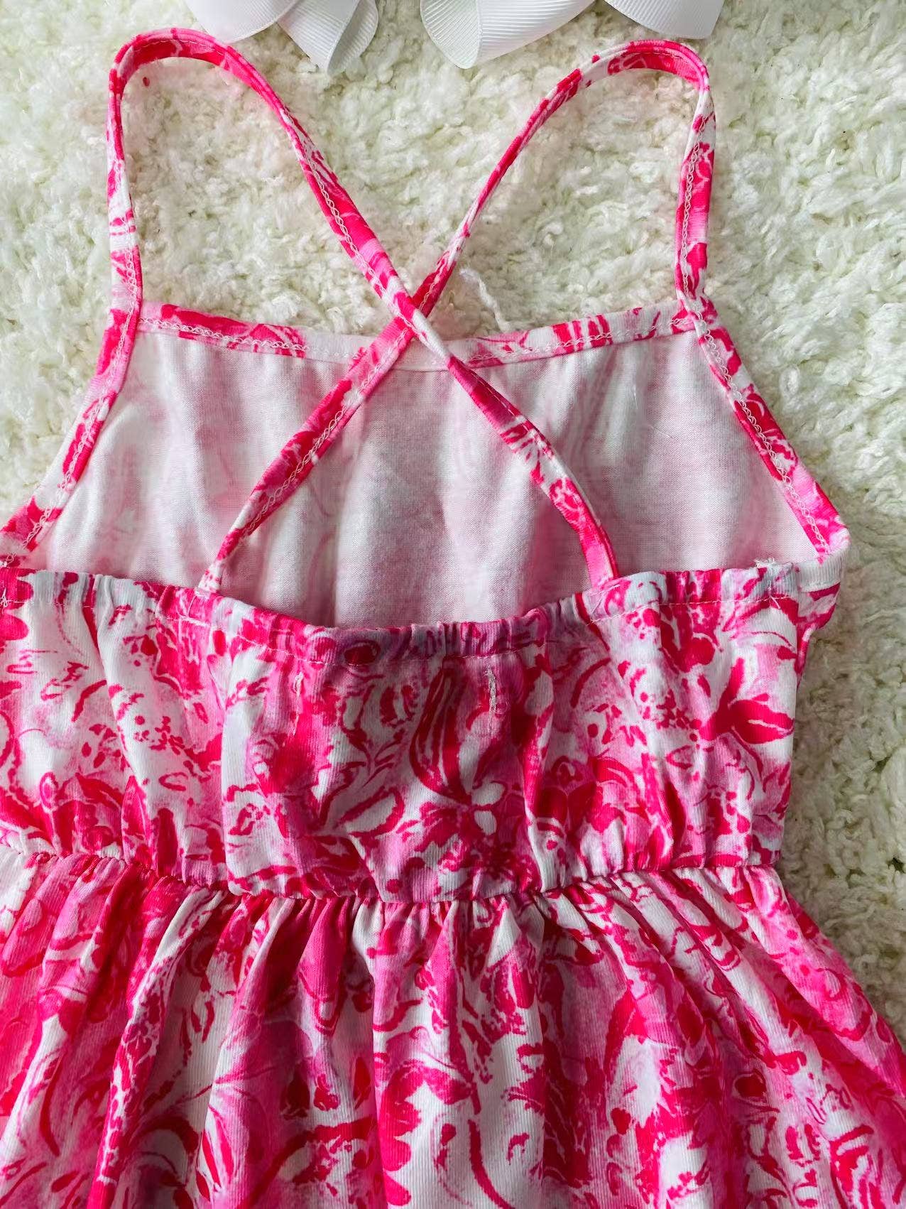 Pink paisley printed sleeveless girls dress w/criss cross